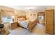 Spacious main bedroom features a large bed, two windows, and traditional furniture at 2718 W Leila Ave, Tampa, FL 33611