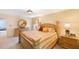 Beautiful main bedroom with a large bed, round mirror, and two bedside tables at 2718 W Leila Ave, Tampa, FL 33611