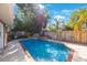 Relaxing backyard pool surrounded by mature trees and landscaping at 2718 W Leila Ave, Tampa, FL 33611