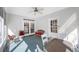 Inviting sunroom with tile flooring, comfortable seating, and plenty of natural light at 2718 W Leila Ave, Tampa, FL 33611