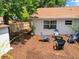 Cozy backyard seating area with chairs surrounding firepit at 2720 Wiltshire Ave, Palm Harbor, FL 34685