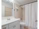 Bathroom featuring a shower and tub with a vanity and a sink at 2720 Wiltshire Ave, Palm Harbor, FL 34685