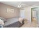 Comfortable bedroom with neutral walls and tile floors providing a serene atmosphere at 2720 Wiltshire Ave, Palm Harbor, FL 34685