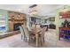 Open kitchen dining area with decorative brick fireplace at 2720 Wiltshire Ave, Palm Harbor, FL 34685