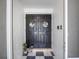 This home features a double-door entry with decor at 2720 Wiltshire Ave, Palm Harbor, FL 34685