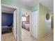 Hallway with tile flooring providing access to other bedrooms, closets and bathrooms at 2720 Wiltshire Ave, Palm Harbor, FL 34685