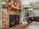 Cozy kitchen and fireplace offer a blend of rustic charm and modern amenities at 2720 Wiltshire Ave, Palm Harbor, FL 34685