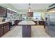 This home features a spacious kitchen with stainless steel appliances and a center island at 2720 Wiltshire Ave, Palm Harbor, FL 34685