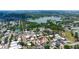 Aerial view of a residential area showcasing the home's location near a lake and surrounded by lush greenery at 2805 W Patterson St, Tampa, FL 33614
