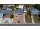 Aerial view of a charming home with mature trees, fountain, brick driveway and well maintained landscaping at 2805 W Patterson St, Tampa, FL 33614