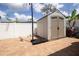 Backyard featuring a new shed on a brick foundation with a basketball hoop in the yard at 2805 W Patterson St, Tampa, FL 33614