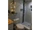 Modern bathroom with upgraded shower panel system, custom tile flooring and marble wall accents at 2805 W Patterson St, Tampa, FL 33614