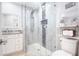 Updated bathroom featuring a glass enclosed shower, granite countertops, and modern fixtures at 2805 W Patterson St, Tampa, FL 33614