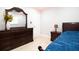 Bedroom featuring tiled floors and a wood dresser at 2805 W Patterson St, Tampa, FL 33614