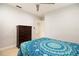 Bedroom featuring tiled floors and a wooden dresser at 2805 W Patterson St, Tampa, FL 33614