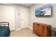 Well-lit bedroom with a TV, closet, and streamlined decor at 2805 W Patterson St, Tampa, FL 33614