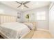 Bright bedroom features tiled floors, a ceiling fan, and a stylish dresser with a mirror at 2805 W Patterson St, Tampa, FL 33614