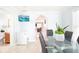 Bright dining room with a glass-top table, seating for six, and an adjacent bathroom at 2805 W Patterson St, Tampa, FL 33614