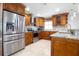Well-equipped kitchen featuring stainless steel appliances, granite countertops, modern cabinetry, and tile flooring at 2805 W Patterson St, Tampa, FL 33614