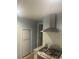 Bright kitchen features stainless steel gas range, granite counters, and white subway tile backsplash at 2805 W Patterson St, Tampa, FL 33614