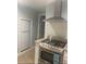 Bright kitchen features stainless steel gas range, granite counters, and white subway tile backsplash at 2805 W Patterson St, Tampa, FL 33614
