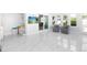 Sunroom area filled with natural light, tile flooring, and comfortable seating at 2805 W Patterson St, Tampa, FL 33614