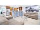 Open-concept living area with kitchen, modern stainless steel appliances, bar seating and elegant decor at 2805 W Patterson St, Tampa, FL 33614
