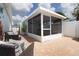 Enclosed patio provides additional living space with comfortable seating at 2805 W Patterson St, Tampa, FL 33614