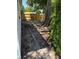 View of the backyard, bordered by a new wooden fence and featuring mature trees and shrubbery at 29813 69Th N St, Clearwater, FL 33761