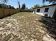 Spacious backyard featuring a new wooden fence, offering ample privacy and outdoor potential at 29813 69Th N St, Clearwater, FL 33761
