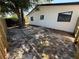 View of the backyard, bordered by a new wooden fence and featuring mature trees at 29813 69Th N St, Clearwater, FL 33761