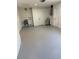 Clean, unfinished basement space with painted floor, ready to be transformed into a personalized area at 29813 69Th N St, Clearwater, FL 33761
