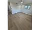 Bright bedroom featuring neutral walls, a closet, plank flooring, and a window letting in natural light at 29813 69Th N St, Clearwater, FL 33761