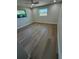 Bright bedroom featuring neutral walls, plank flooring, and two windows that provide natural light at 29813 69Th N St, Clearwater, FL 33761