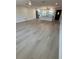 Inviting living room open to a modern kitchen, with beautiful floors and plenty of natural light, perfect for entertaining at 29813 69Th N St, Clearwater, FL 33761