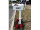 White mailbox with the house number and red flowers at 29813 69Th N St, Clearwater, FL 33761