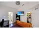 Bedroom featuring wood floors, a closet, and a view of an attached bathroom at 302 Summer Sails Dr, Valrico, FL 33594