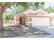 Charming single-story home featuring a well-manicured front yard and an attached two-car garage at 302 Summer Sails Dr, Valrico, FL 33594