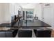 Open kitchen featuring a breakfast bar, stainless steel appliances, and white cabinetry at 302 Summer Sails Dr, Valrico, FL 33594
