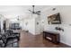 Living room and kitchen feature wood floors, an entertainment center, and bar seating at 302 Summer Sails Dr, Valrico, FL 33594