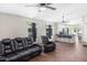 Open-concept living room flowing into the modern kitchen with tile floors and ceiling fans at 302 Summer Sails Dr, Valrico, FL 33594