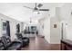 Large living room boasting tile flooring, ceiling fans, and an open layout with a view into the kitchen at 302 Summer Sails Dr, Valrico, FL 33594