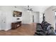 Open-concept living room showcases a fireplace, TV, and a reclining sofa at 302 Summer Sails Dr, Valrico, FL 33594