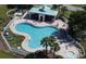 Aerial view of the community pool with seating, a pavilion, and a hot tub at 302 Summer Sails Dr, Valrico, FL 33594