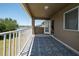 Outdoor balcony overlooking a serene lake and community with lush greenery at 30526 Annadale Dr, Wesley Chapel, FL 33545