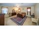 Primary bedroom featuring warm colors, a ceiling fan, and coordinated furnishings at 30526 Annadale Dr, Wesley Chapel, FL 33545