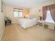 Cozy bedroom featuring a comfortable bed, soft lighting, and a calming color palette at 30526 Annadale Dr, Wesley Chapel, FL 33545