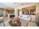 Spacious living room featuring tile floors and an open concept design with a view of the kitchen at 30526 Annadale Dr, Wesley Chapel, FL 33545