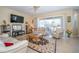 Open concept living room filled with natural light and views of the backyard at 30526 Annadale Dr, Wesley Chapel, FL 33545