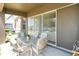 Outdoor patio with a dining table and chairs, sliding doors and view of the backyard at 30526 Annadale Dr, Wesley Chapel, FL 33545